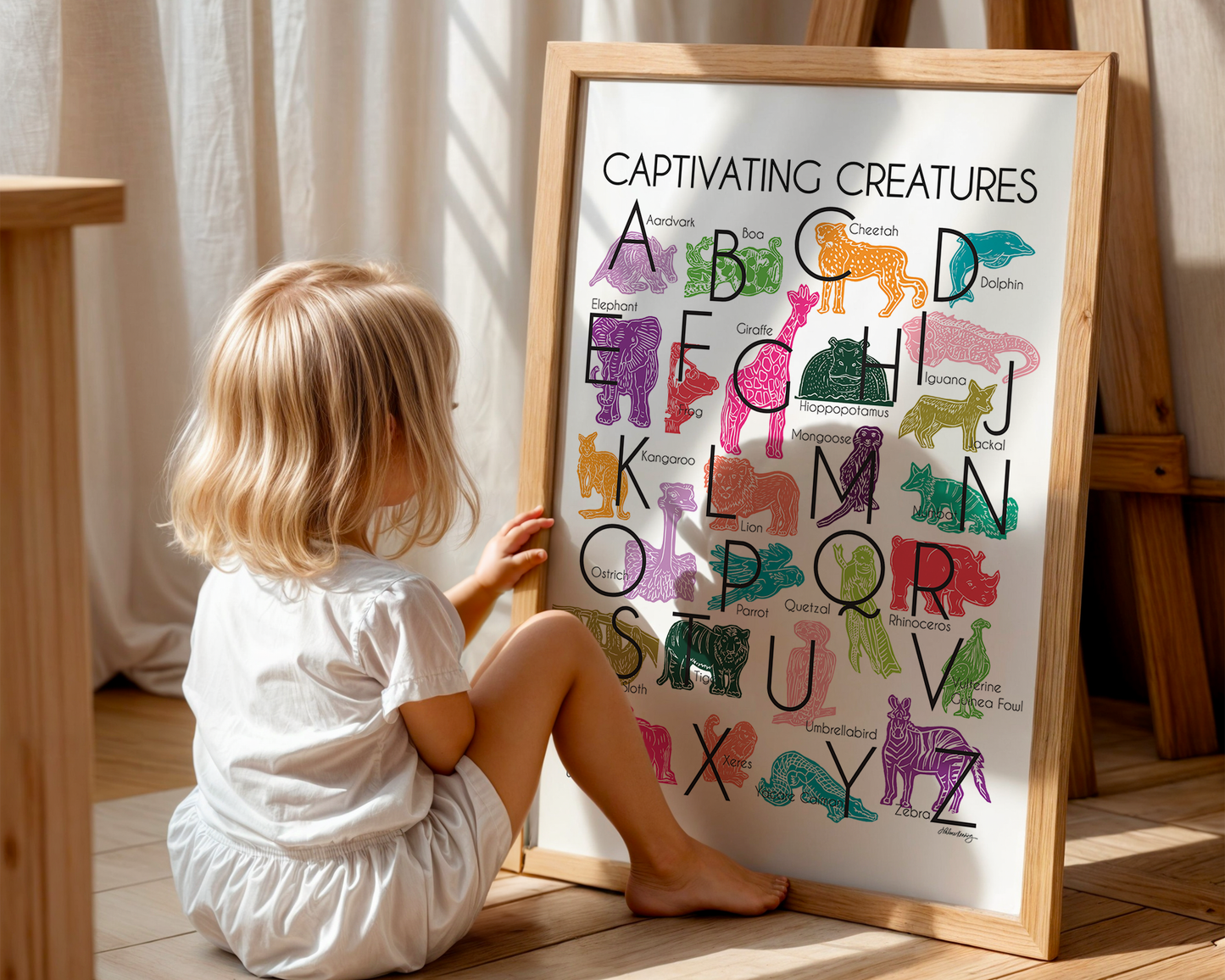 Jewel-tones illustrated creatures for every letter of the alphabet printed on white background. Modern, slim text in black. Unusual creatures from aardvark to zebra.