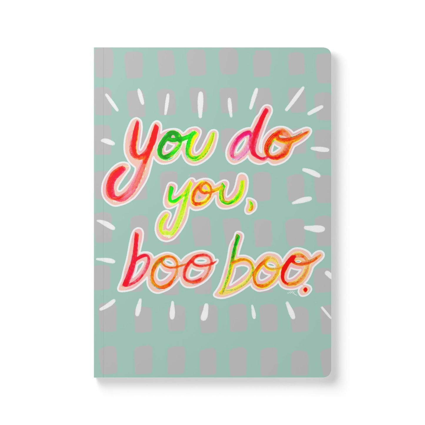 Hand written letters in neon colors decorate a painted teal cover saying “You do you, boo boo.”