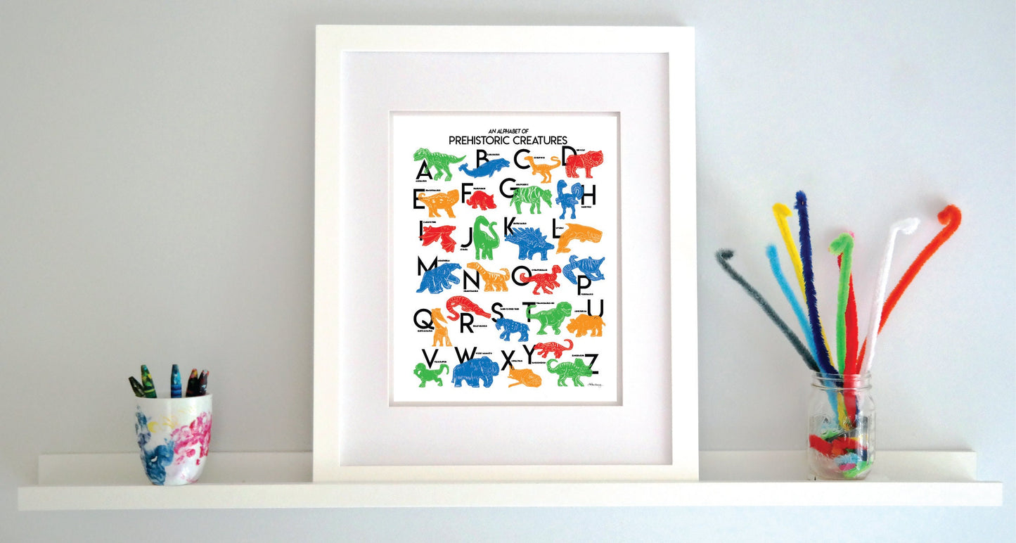Colorful illustrated prehistoric creatures for every letter of the alphabet printed on a white background. Modern, slim text in black. Color palette is red, green blue, red and orange.