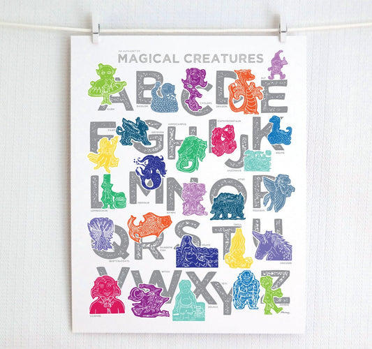 Colorful illustrated magical creatures for every letter of the alphabet printed on a white background. Chunky illustrated letters in gray sit behind each character. Colors are jewel-toned and include pinks and purples, blues and greens, yellows and reds.