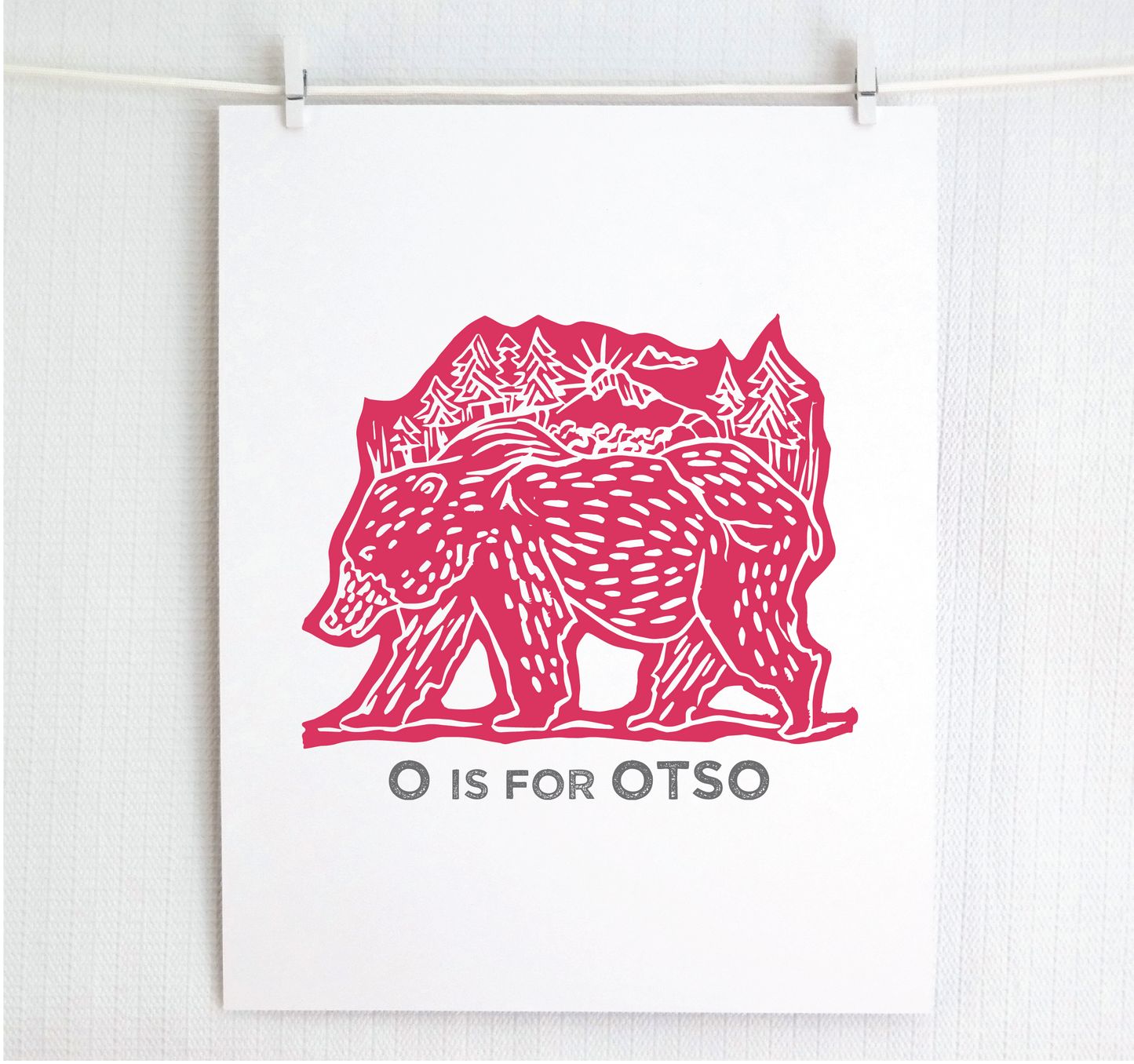 Friendly illustrated bear walking with the forest growing on his back. “O is for Otso” text in a gray block font below.