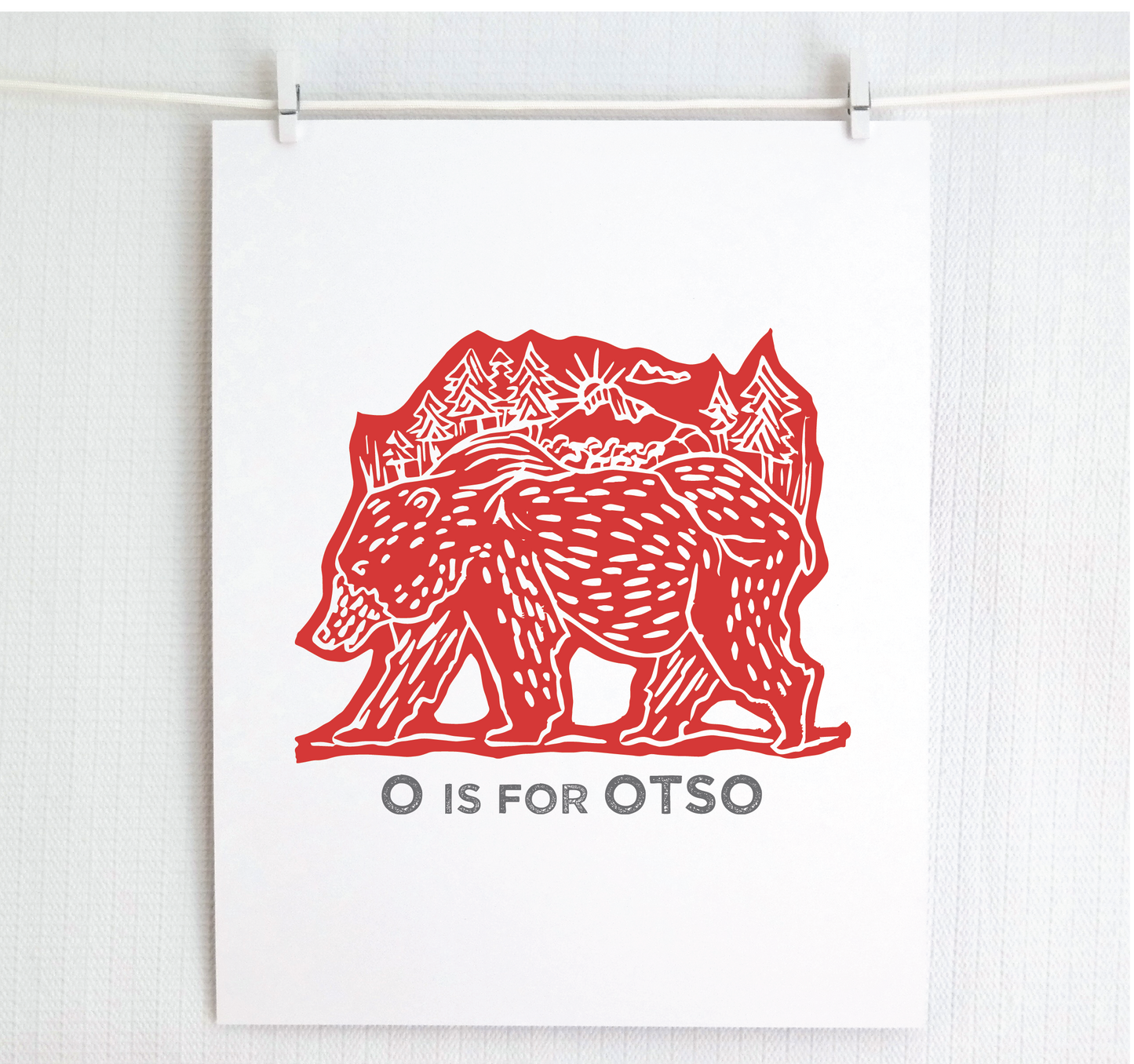 Friendly illustrated bear walking with the forest growing on his back. “O is for Otso” text in a gray block font below.