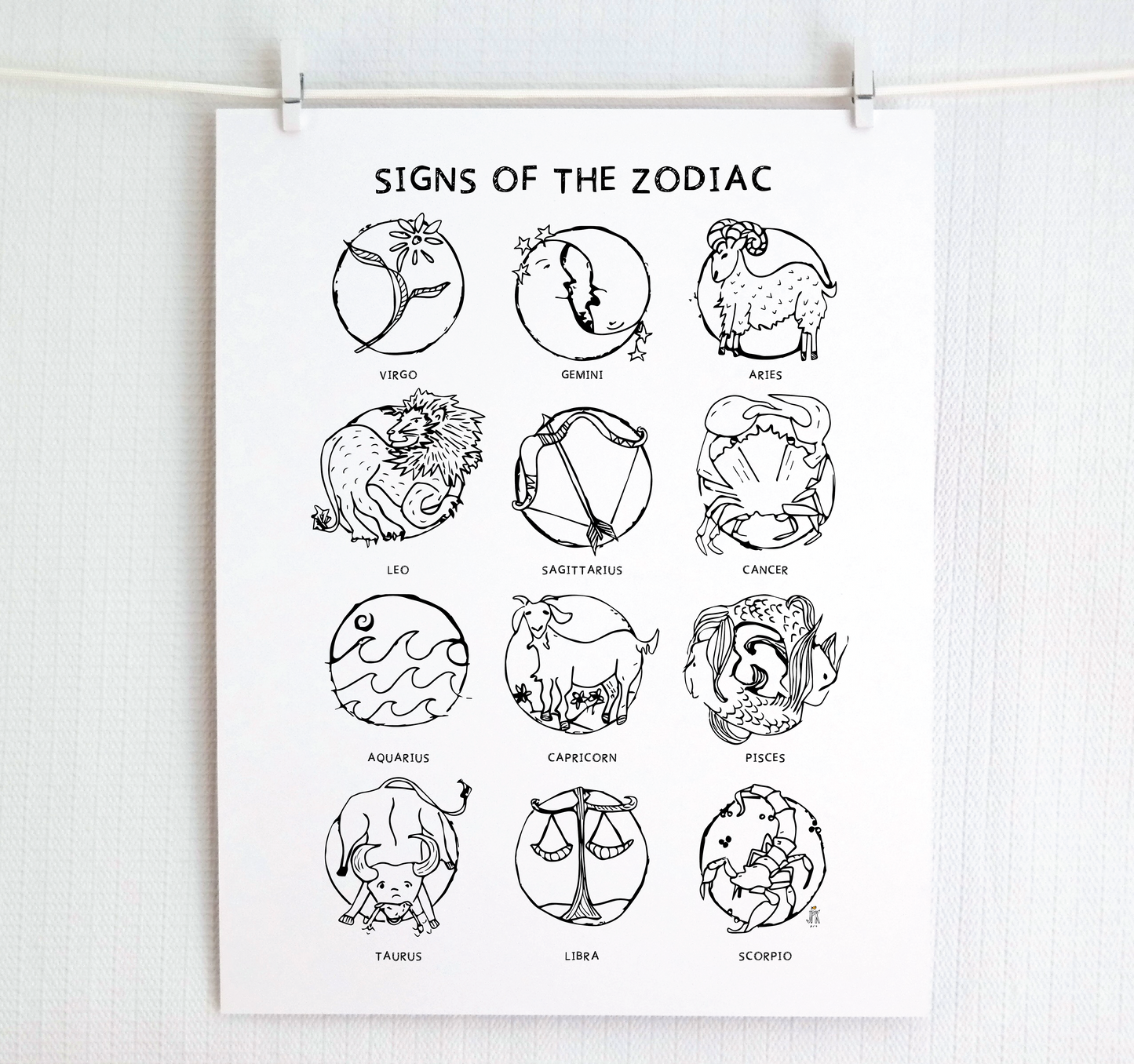 The 12 zodiac signs are illustrated using the printmaking approach. Colors are gold, red, and teal jewel tones on white paper with handwritten block letter font.