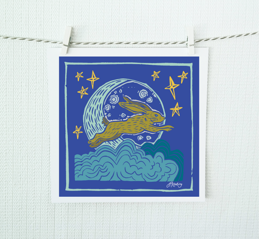Illustration of a rabbit leaping over a moonlit sky with stars, hanging on a string against a white background.