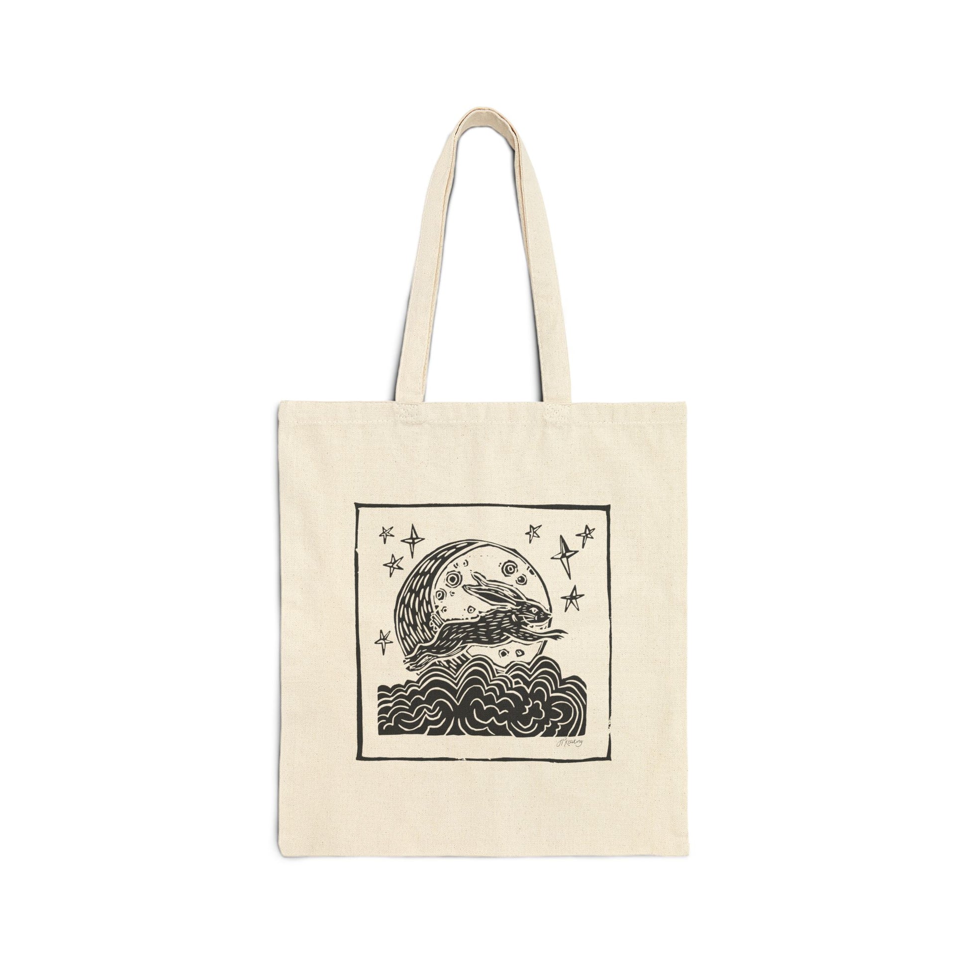 Beige tote bag with black rabbit design on a white background