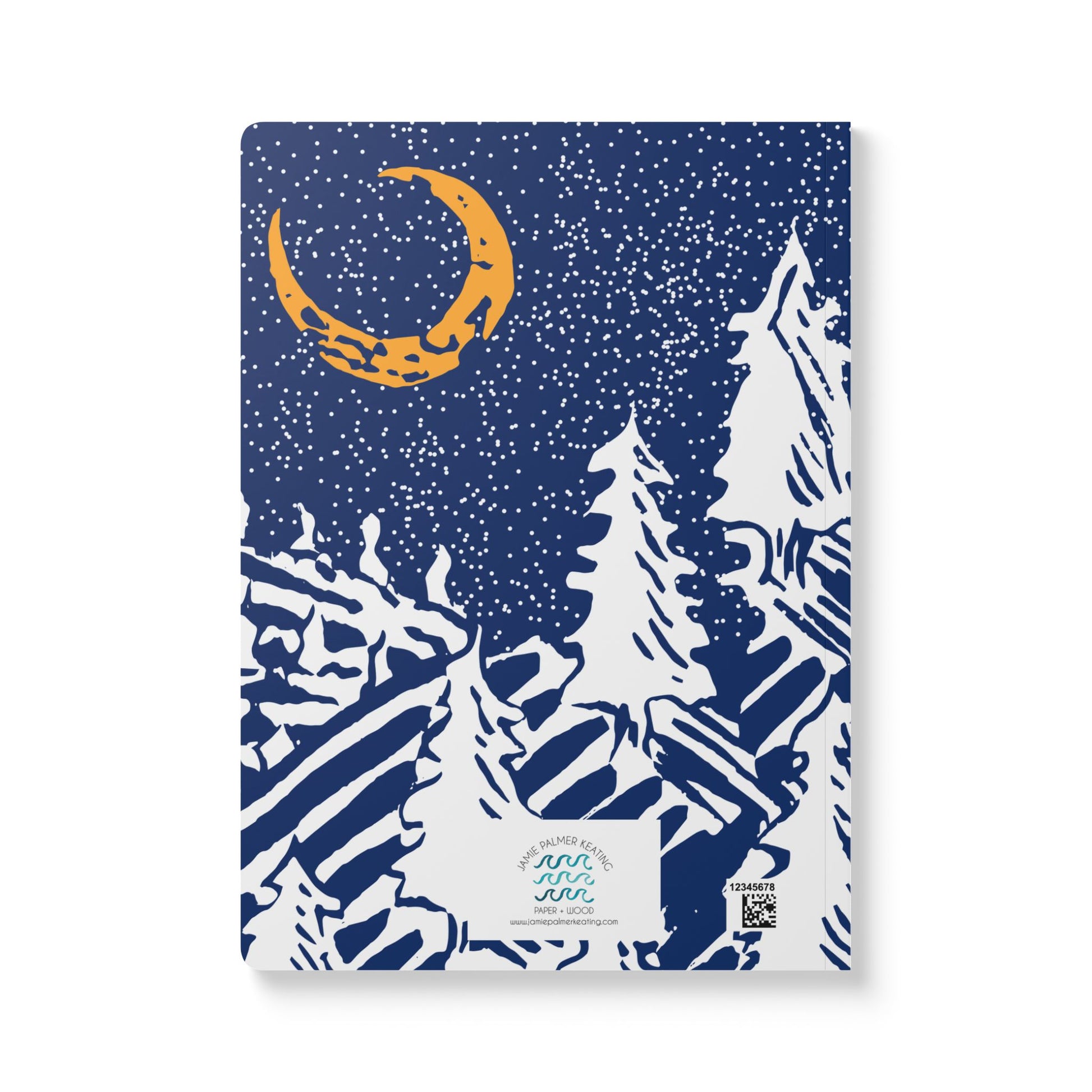 A yellow crescent moon hands in a sky of stars over a frosty hill with snow covered pines. Navy blue background.
