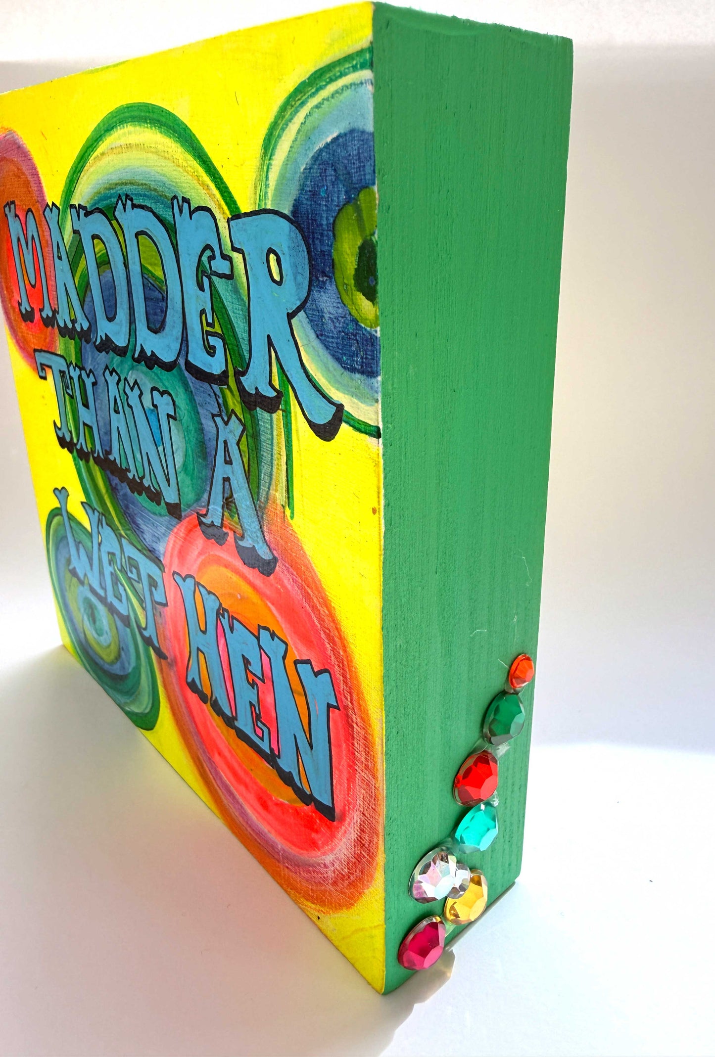 Colorful book with text and decorative elements on a white background