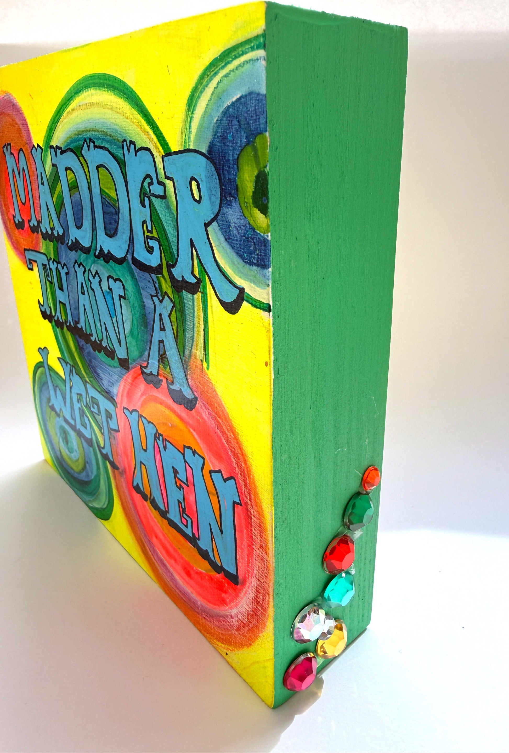 Colorful book with text and decorative elements on a white background