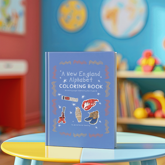 Coloring book titled 'A New England Alphabet Coloring Book' on a table with a colorful background