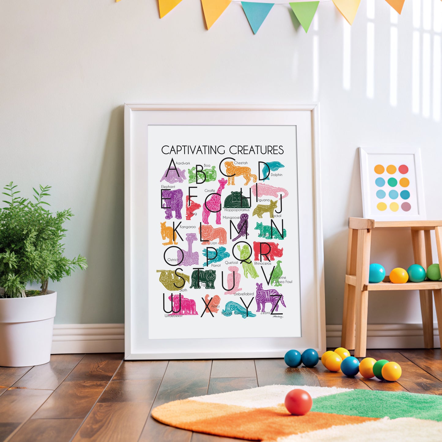 Jewel-tones illustrated creatures for every letter of the alphabet printed on white background. Modern, slim text in black. Unusual creatures from aardvark to zebra.
