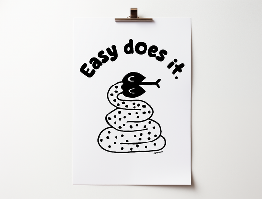 Handwritten thin letters spelling out “Easy Does It.” Illustrated snake character in black on a white background with clean lines. Inspired by the western United States.
