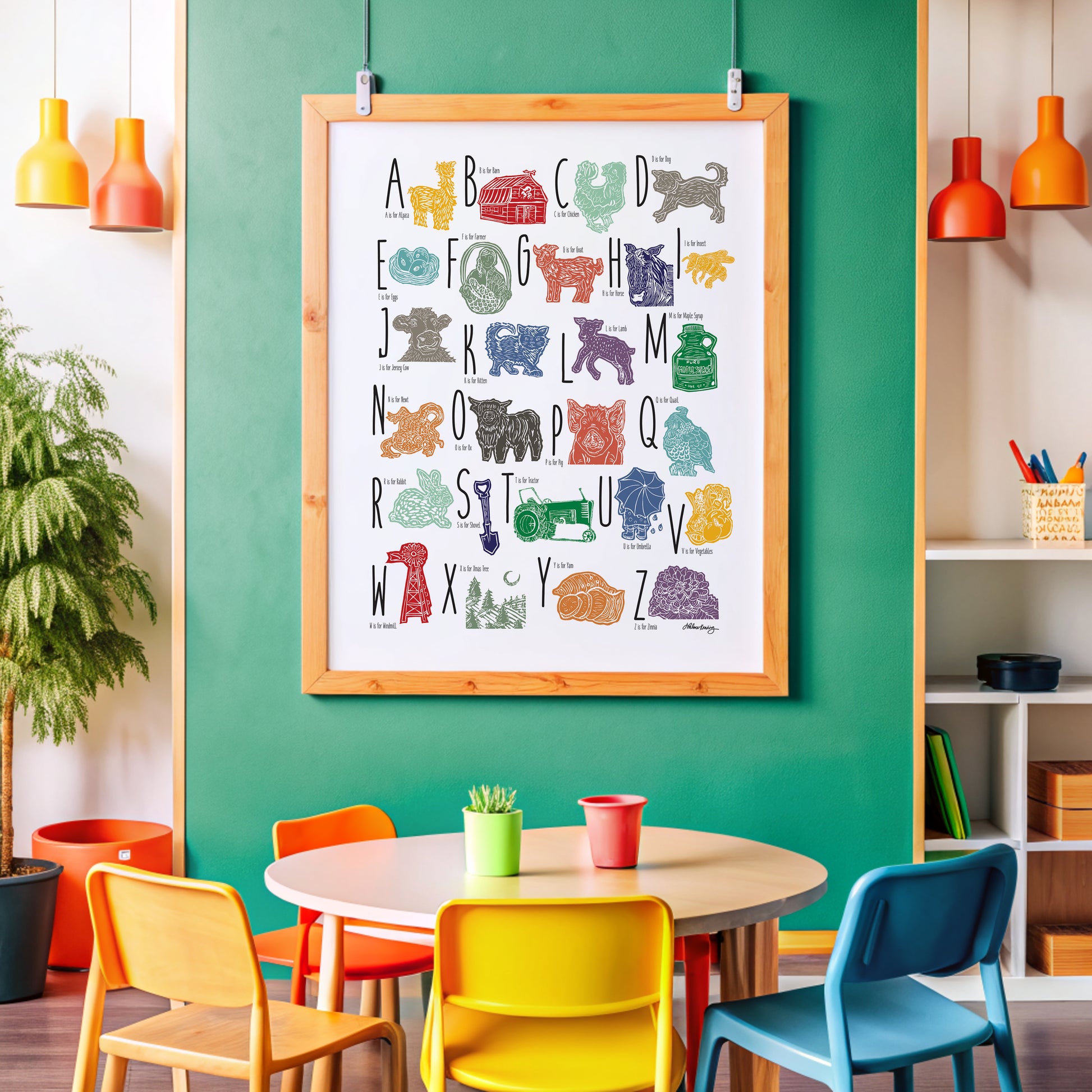 A colorful woodblock print alphabet poster featuring illustrations of farm animals, displayed on a green wall.