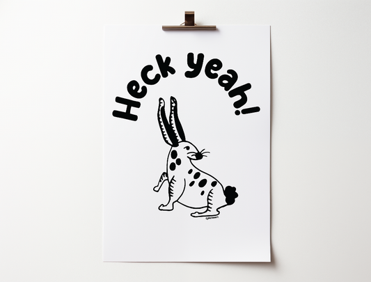 Handwritten bubble letters spelling out “Heck Yeah!” Illustrated rabbit character in black on a white background with clean lines. Inspired by the southwest and western United States.

