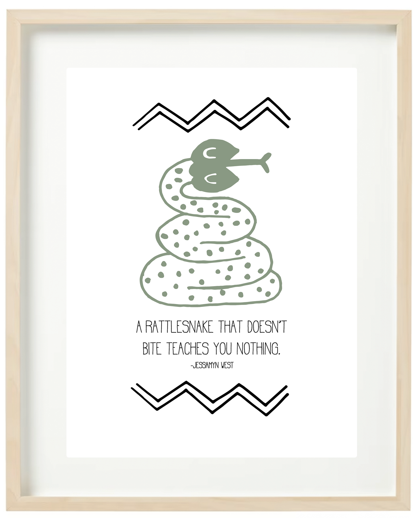 An illustrated print featuring a green snake with text 'A RATTLESNAKE THAT DOESN'T BITE TEACHES YOU NOTHING' on a white background with black decorative patterns framed