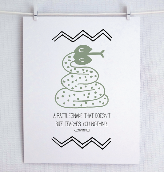 An illustrated print featuring a green snake with text 'A RATTLESNAKE THAT DOESN'T BITE TEACHES YOU NOTHING' on a white background with black decorative patterns.