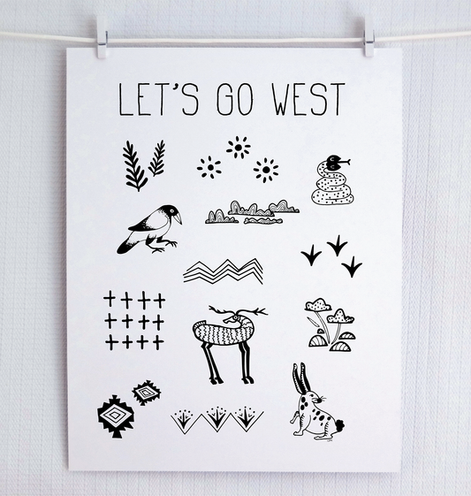 Handwritten thin letters spelling out “Let’s Go West.” Illustrated characters in black on a. white background with clean lines, include snake, crow, deer and rabbit with flora and fauna. Inspired by the southwest and western United States.
