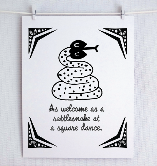 An illustrated rattle snake with friendly eyes and polka dots sits over a rope-style font that says “As welcome as a rattlesnake at a square dance.” Decorative corner design reminiscent of the wild west.
