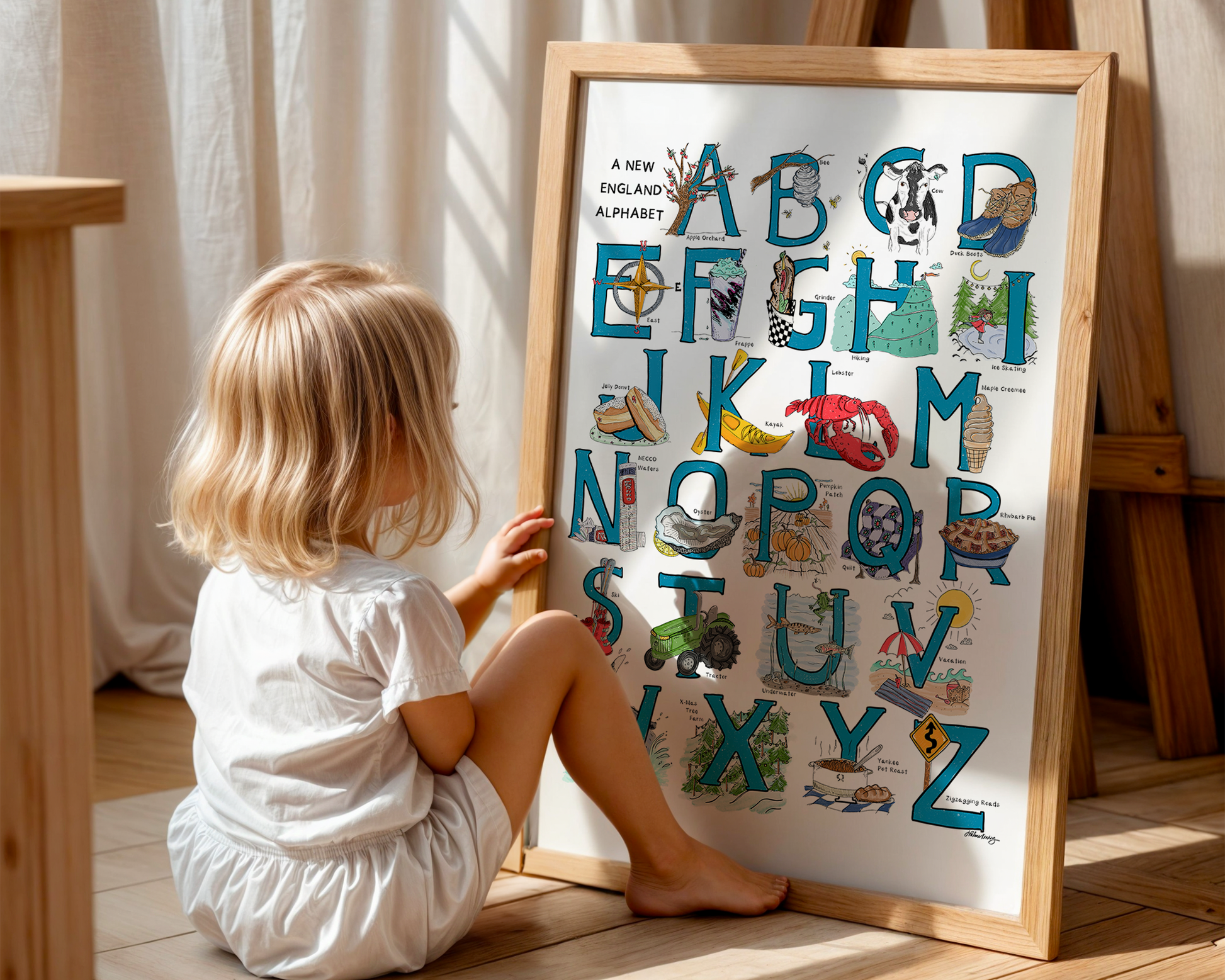 An illustrated alphabet of New England objects associated with each letter. Blue hand-drawn letters with colorful objects on a white background.
