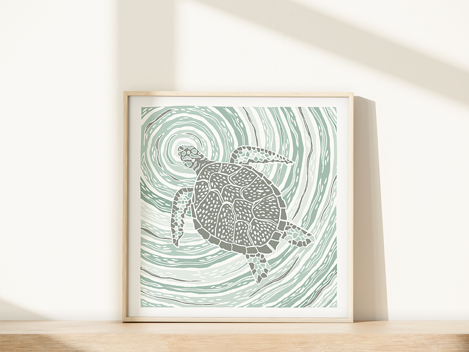 Framed artwork of a turtle design on a wave pattern