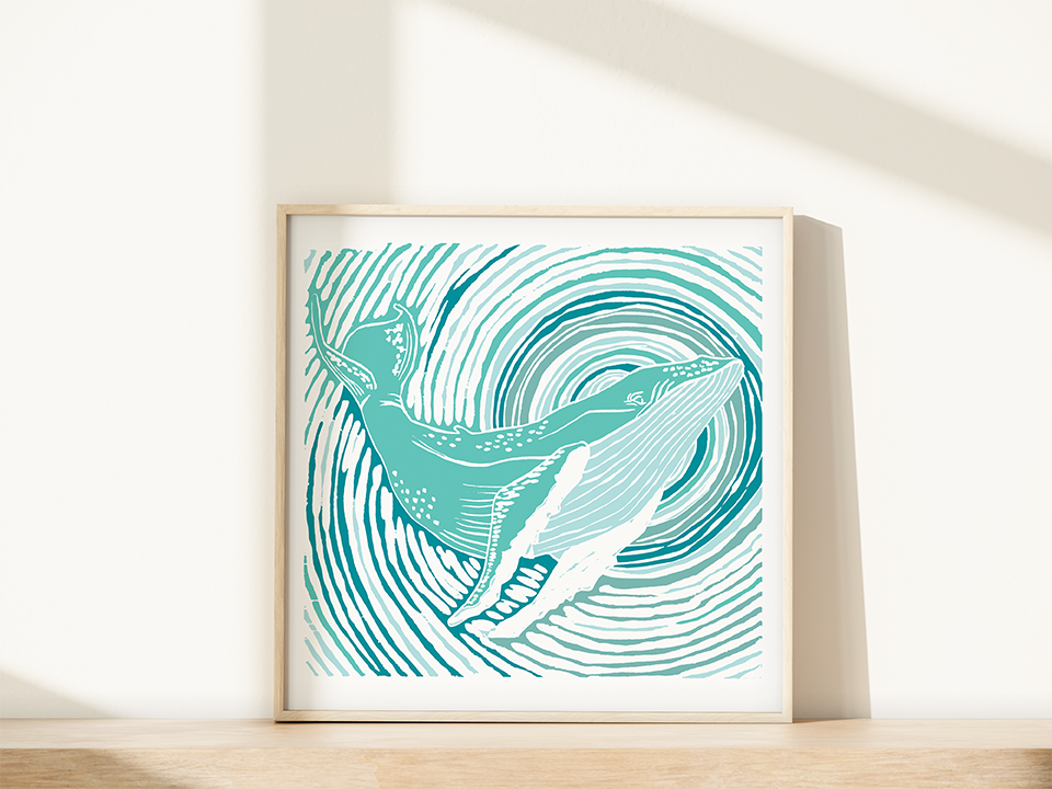 Framed artwork of a whale framed against a white wall.