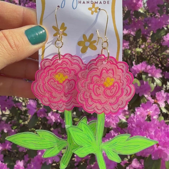 Pink peony flowers swaying on printed card