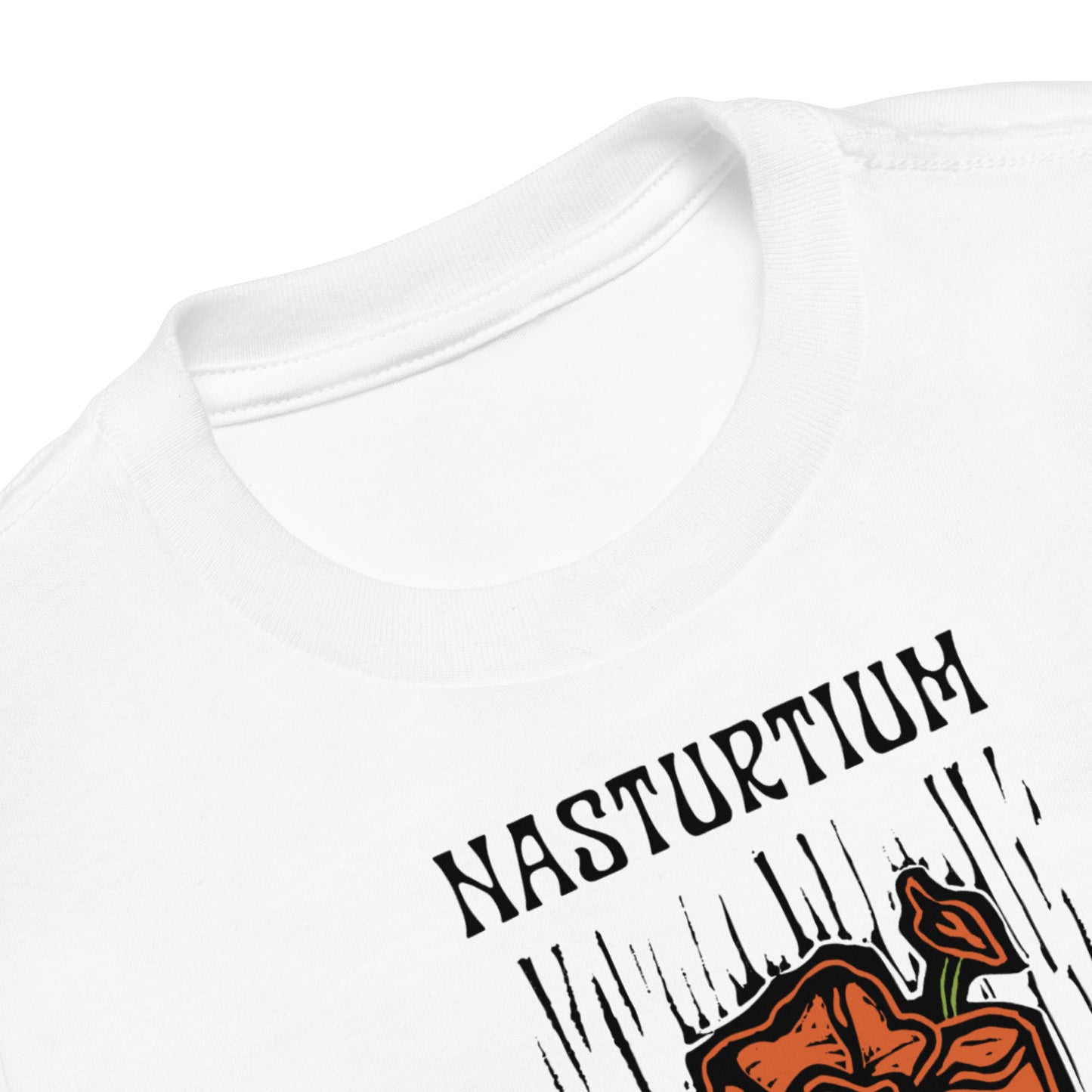 Close-up of a white crewneck t-shirt featuring a black 'NASTURIUM' text graphic and an orange flower illustration on the front.
