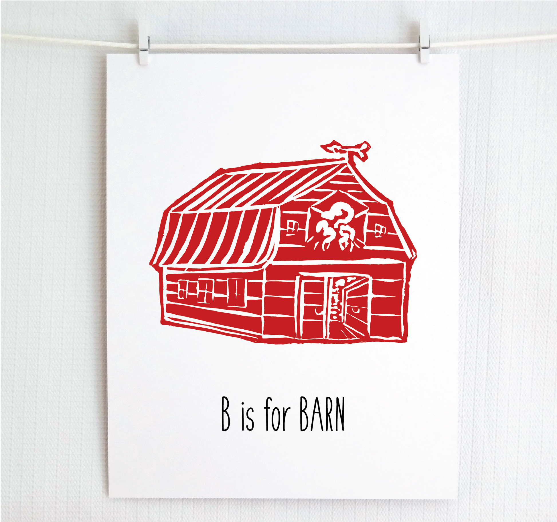 An illustrated barn with stands with an open door and arrow weathervane over hand written style, thin block lettering text that says “B for Barn.”

