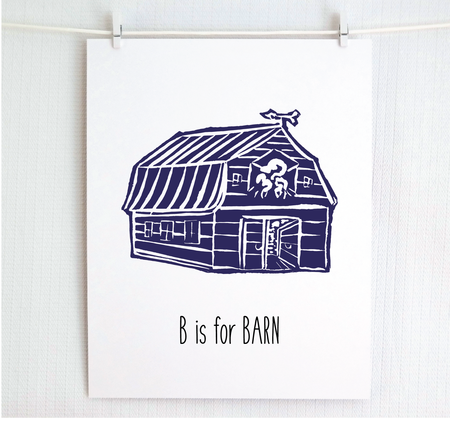 An illustrated barn with stands with an open door and arrow weathervane over hand written style, thin block lettering text that says “B for Barn.”
