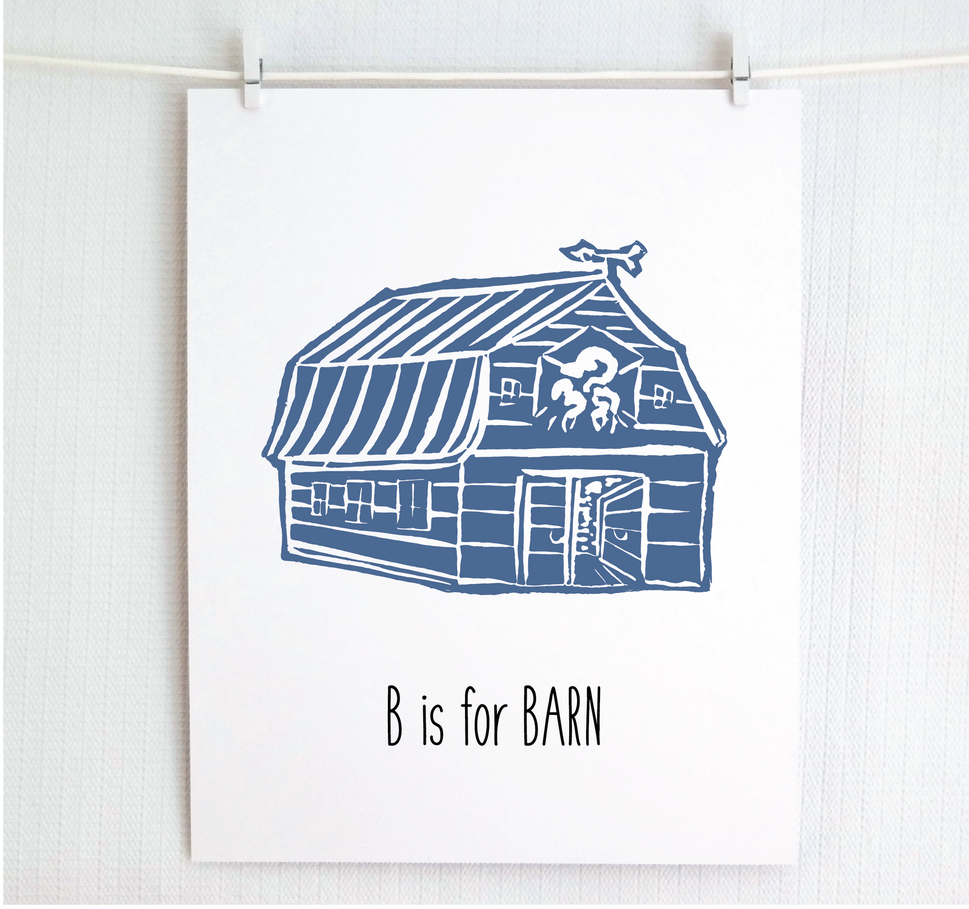 An illustrated barn with stands with an open door and arrow weathervane over hand written style, thin block lettering text that says “B for Barn.”

