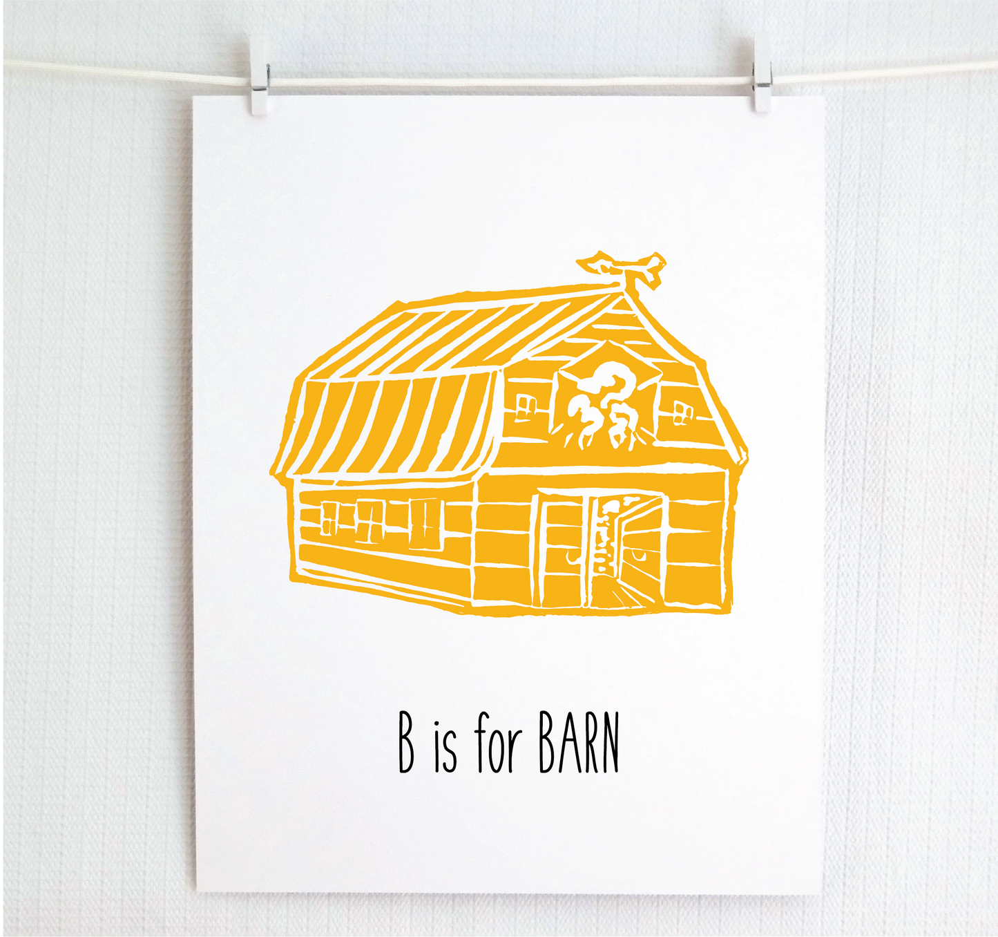 An illustrated barn with stands with an open door and arrow weathervane over hand written style, thin block lettering text that says “B for Barn.”
