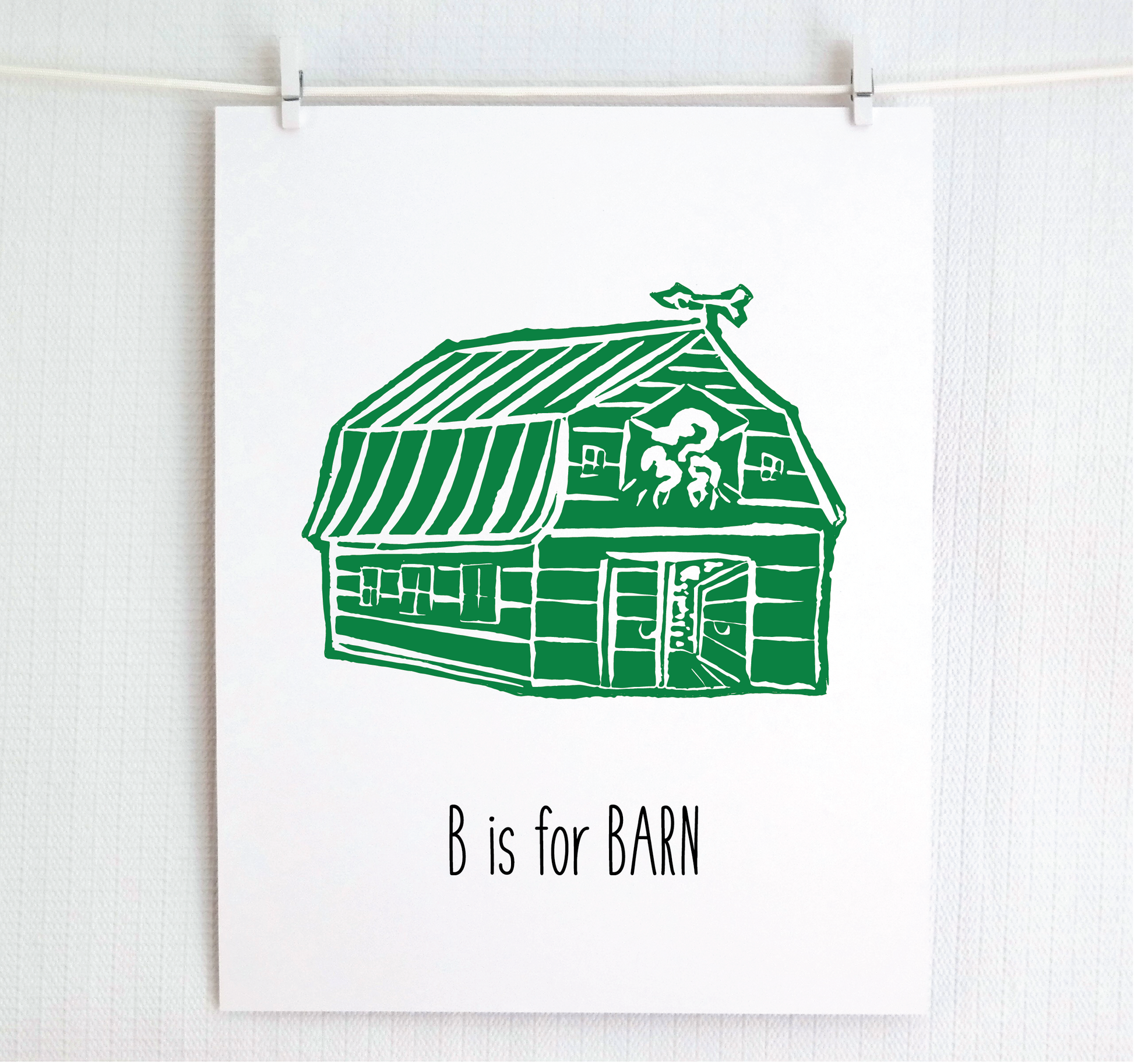An illustrated barn with stands with an open door and arrow weathervane over hand written style, thin block lettering text that says “B for Barn.”
