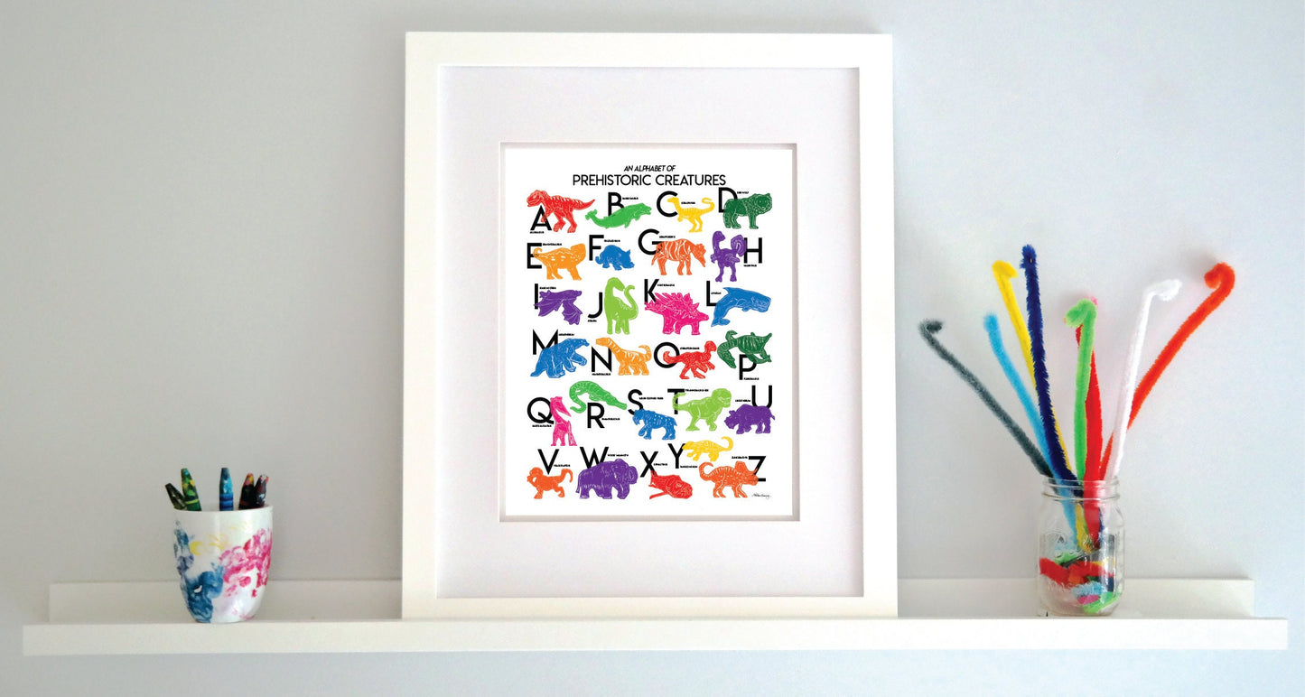 Colorful illustrated prehistoric creatures for every letter of the alphabet printed on a white background. Modern, slim text in black. Color palette is red, lime green, dark green, light blue, red, orange, pink and purple.
