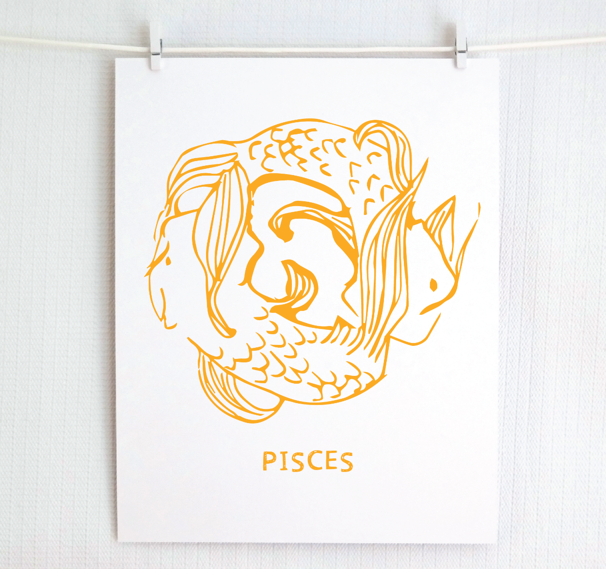 Framed Pisces zodiac art in gold.
