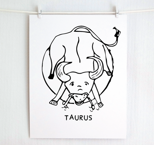 An illustration of the TAURUS Zodiac sign as a bull, printed on paper with the word ‘TAURUS’ at the bottom.
