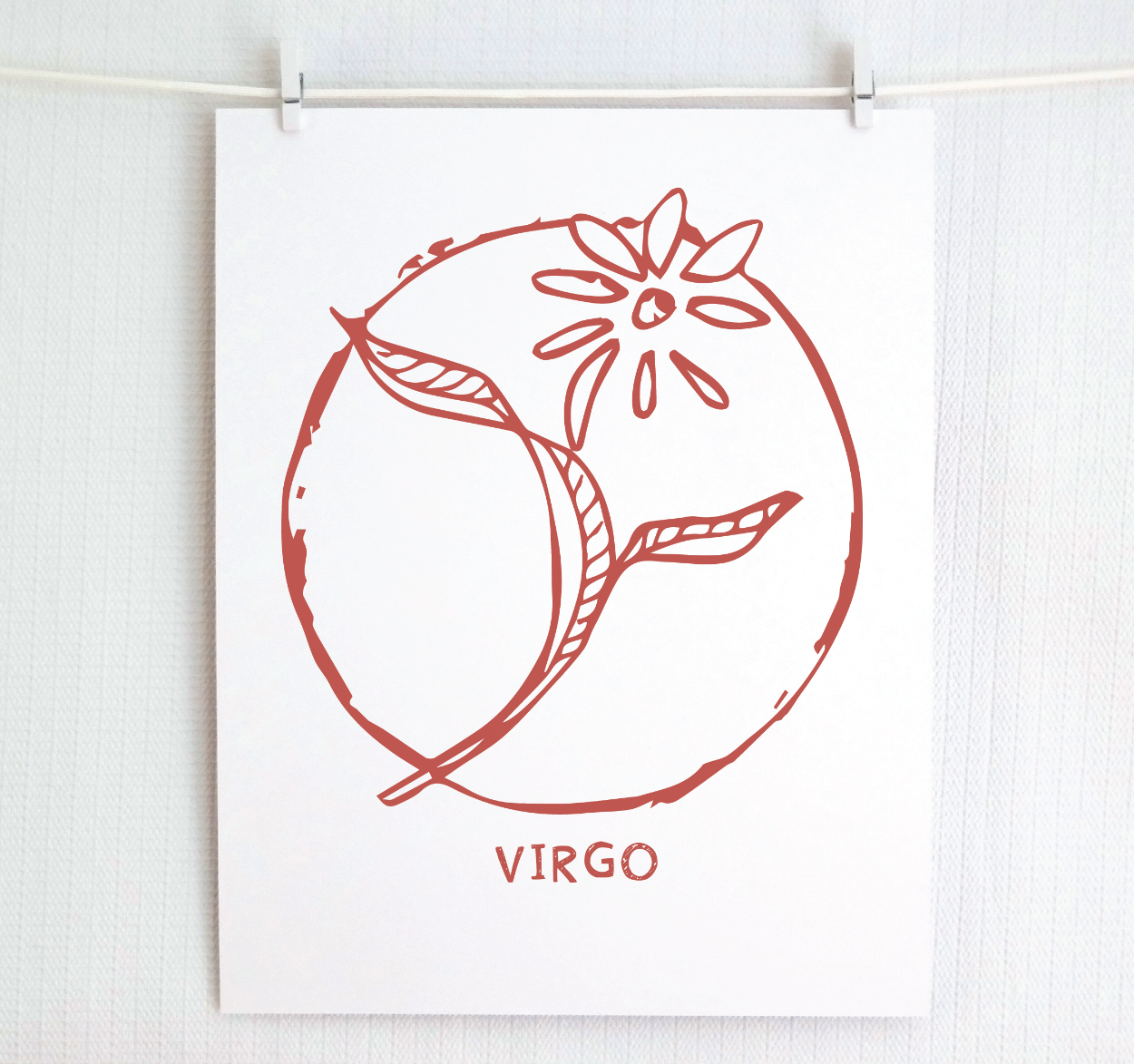 An illustration of the VIRGO Zodiac sign as a flower, printed on paper with the word ‘VIRGO’ at the bottom in blush.