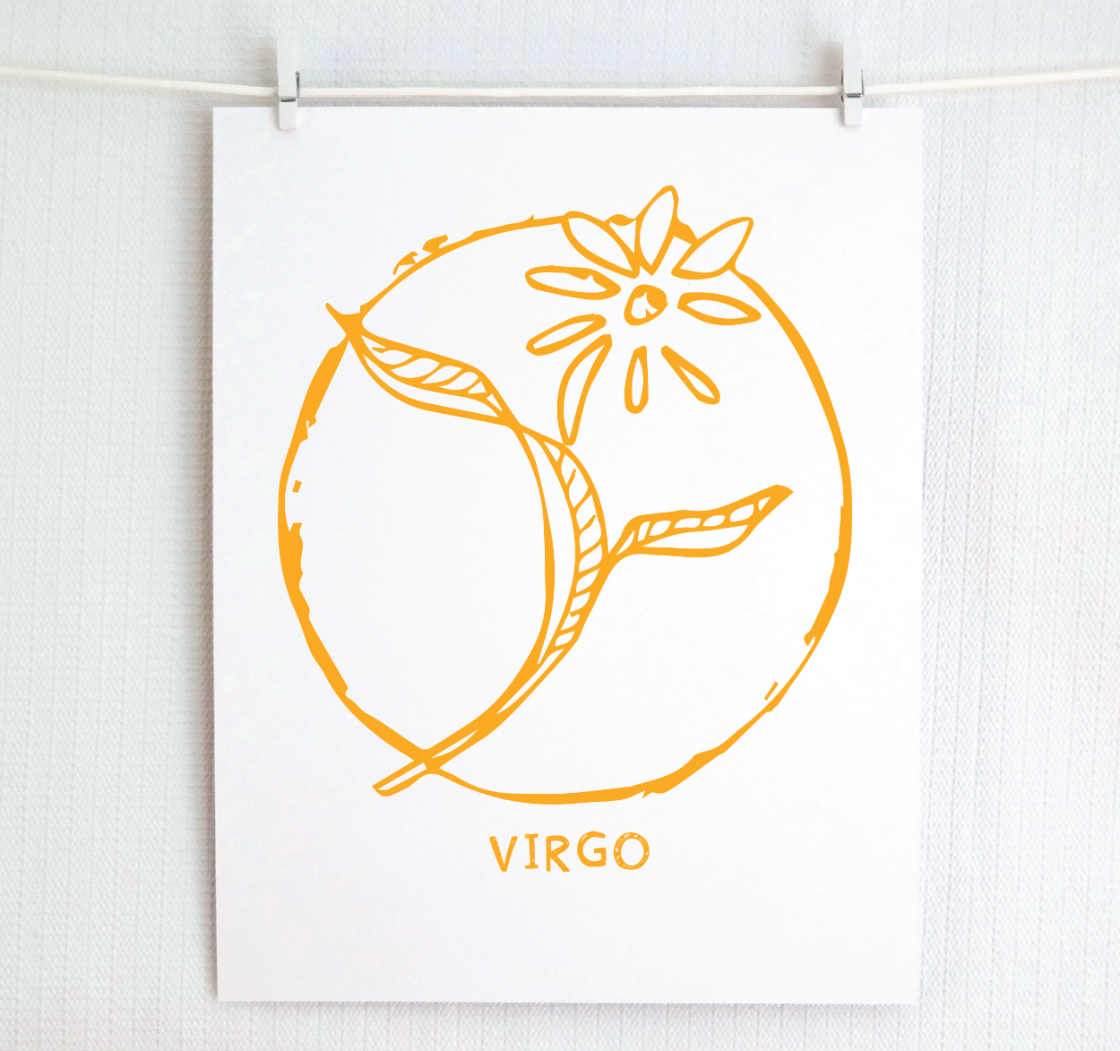 An illustration of the VIRGO Zodiac sign as a flower, printed on paper with the word ‘VIRGO’ at the bottom in gold.