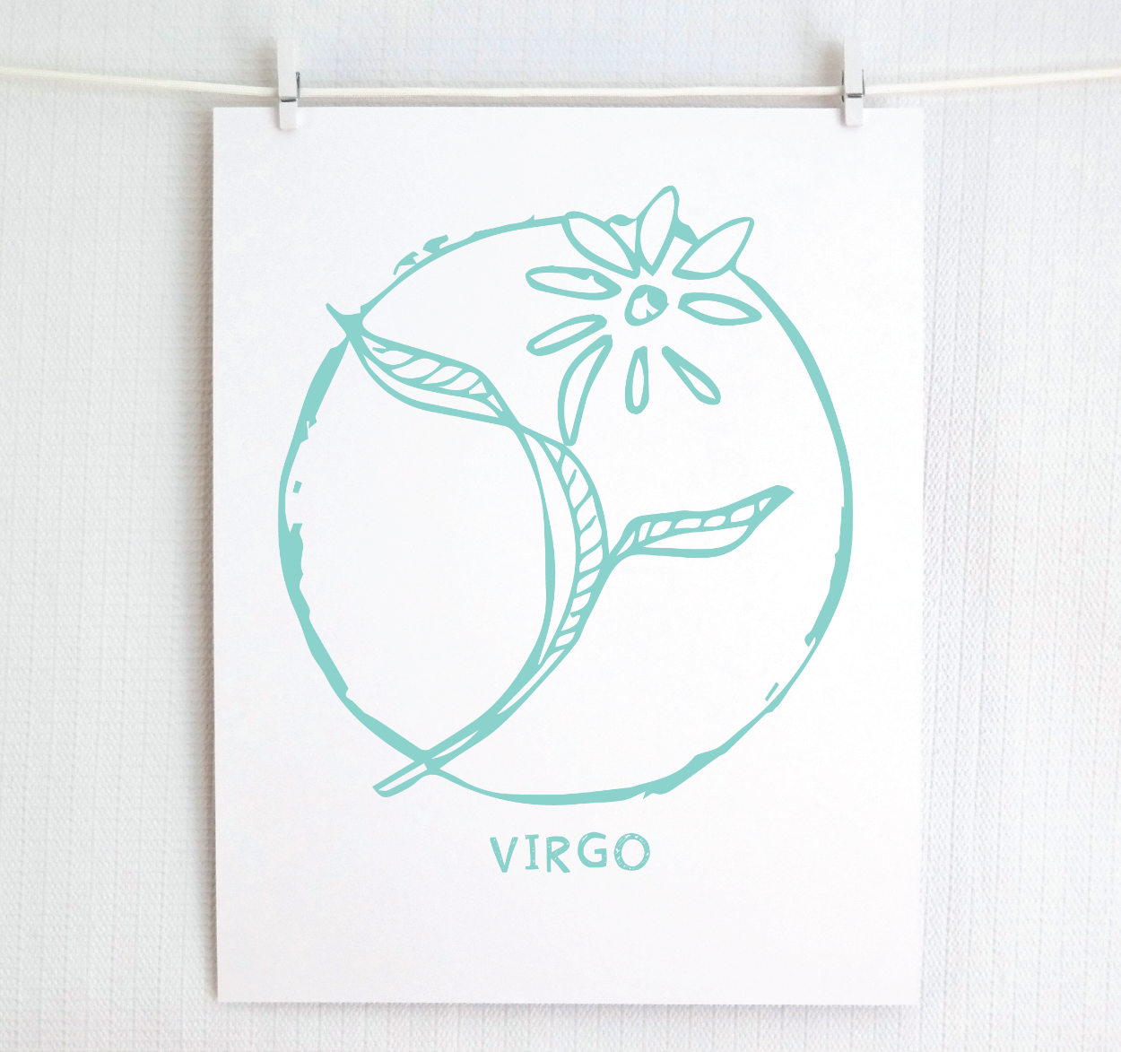 An illustration of the VIRGO Zodiac sign as a flower, printed on paper with the word ‘VIRGO’ at the bottom in teal.