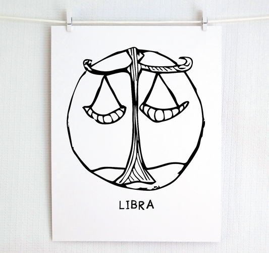 An illustration of the Libra Zodiac sign, printed on paper with the word 'LIBRA' at the bottom in black and white