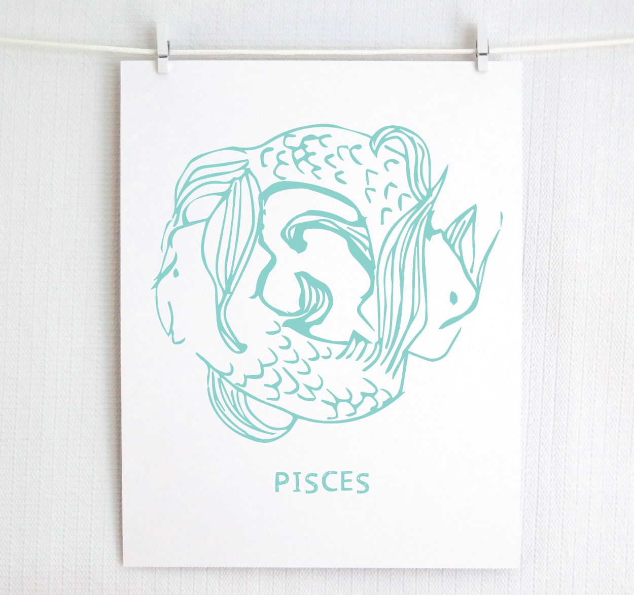 Framed Pisces zodiac art in teal.